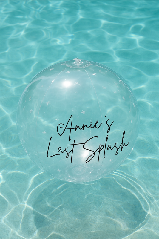 Clear balloon with custom text floating in clear blue water