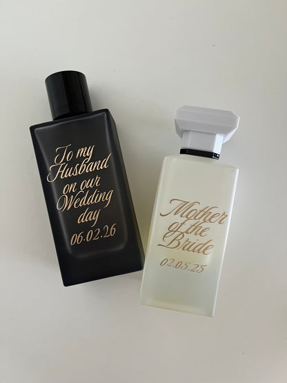 Two personalized perfume bottles on a white background