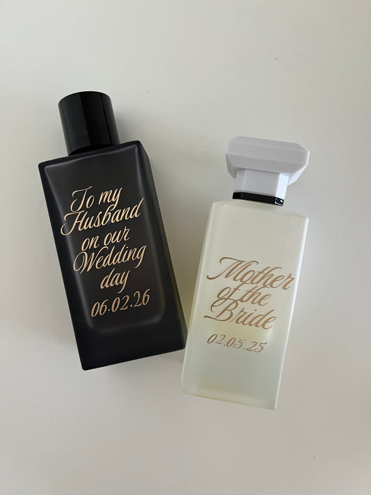 Two personalized perfume bottles on a white background